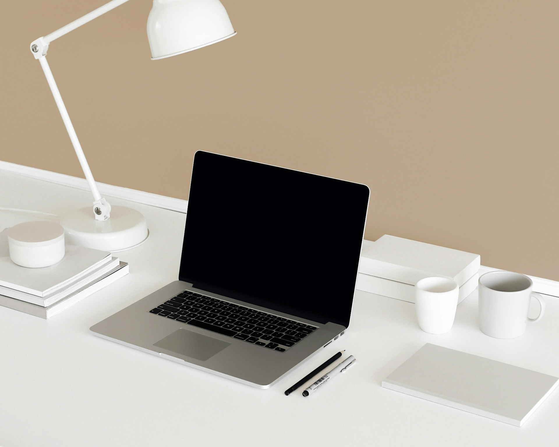 Warm, sunlit consulting workspace with linen, wood and natural light